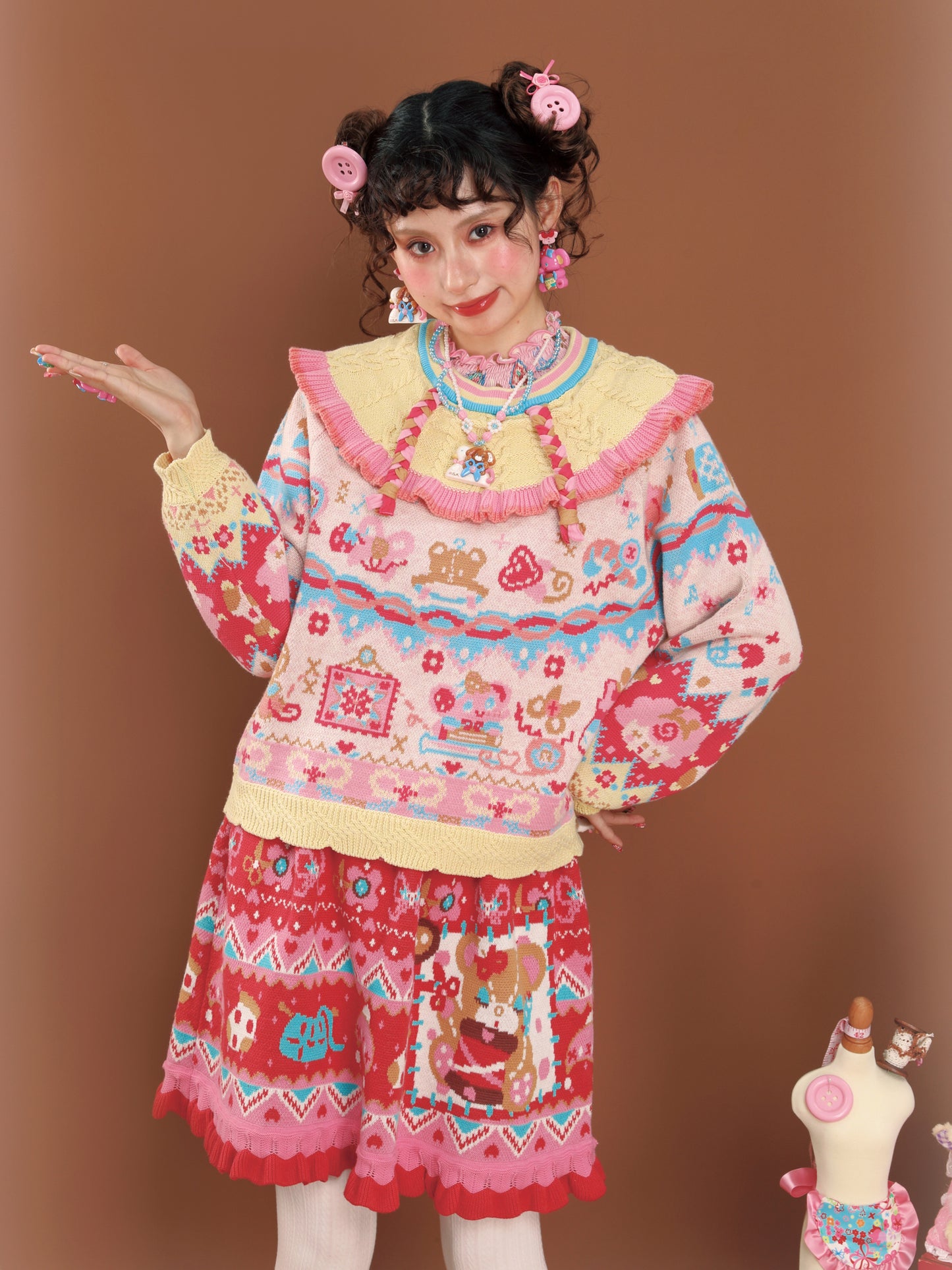 Cable knit sweater with a large lapel collar and contrasting pastel colors, a versatile and retro-style pullover.