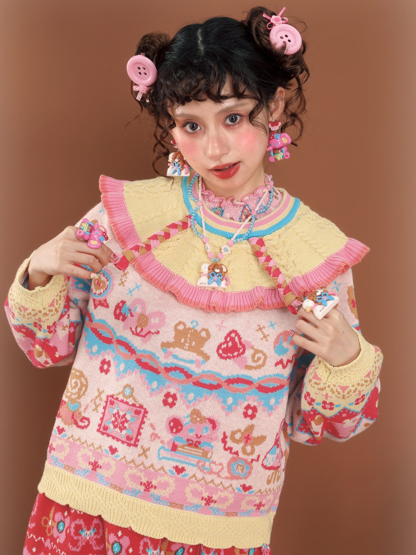 Cable knit sweater with a large lapel collar and contrasting pastel colors, a versatile and retro-style pullover.