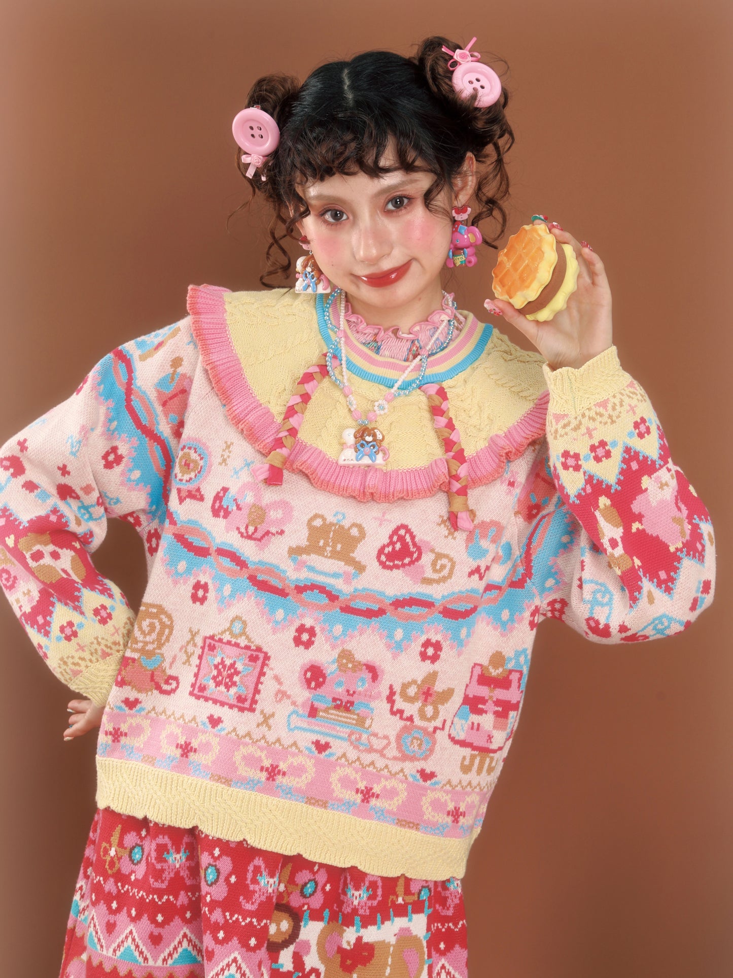 Cable knit sweater with a large lapel collar and contrasting pastel colors, a versatile and retro-style pullover.