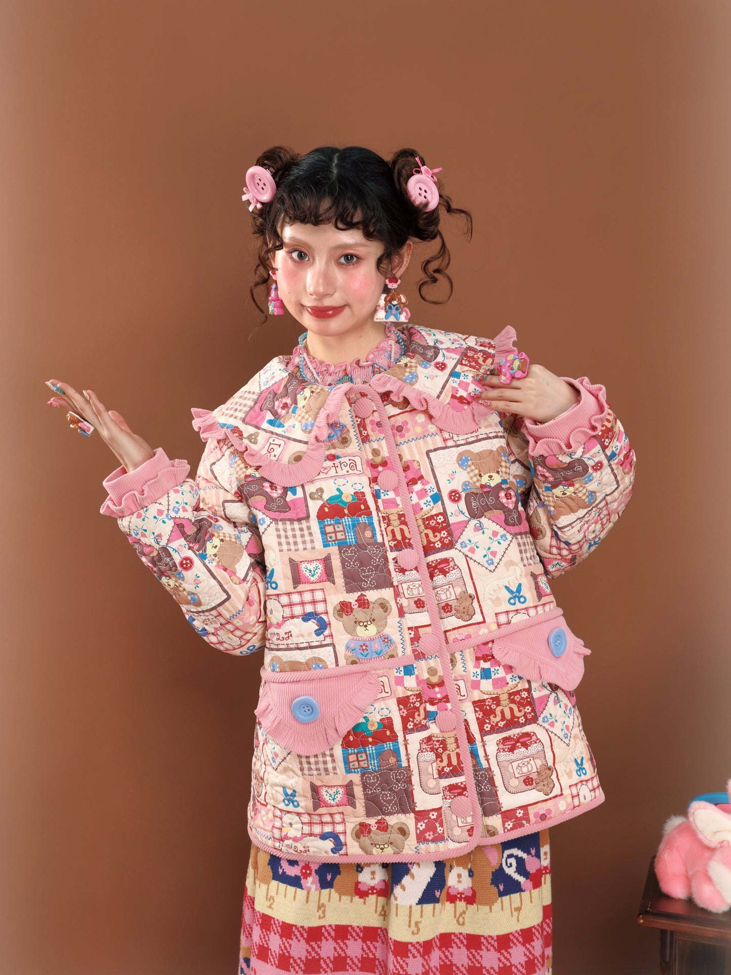 Pink patchwork-style printed loose-fitting warm quilted cotton jacket.