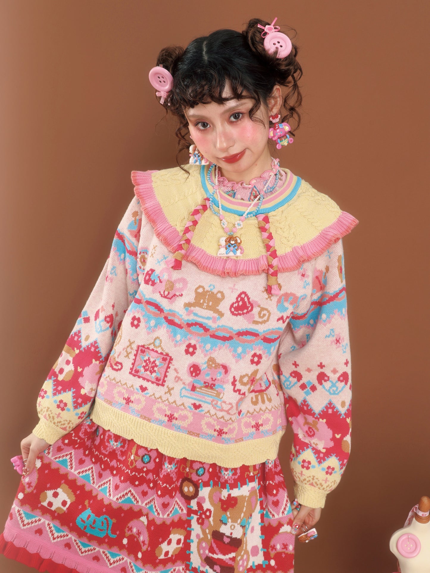 Cable knit sweater with a large lapel collar and contrasting pastel colors, a versatile and retro-style pullover.